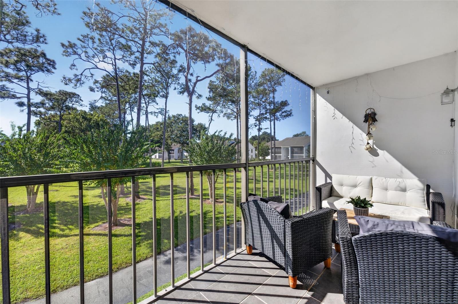 Screened balcony with garden views!
