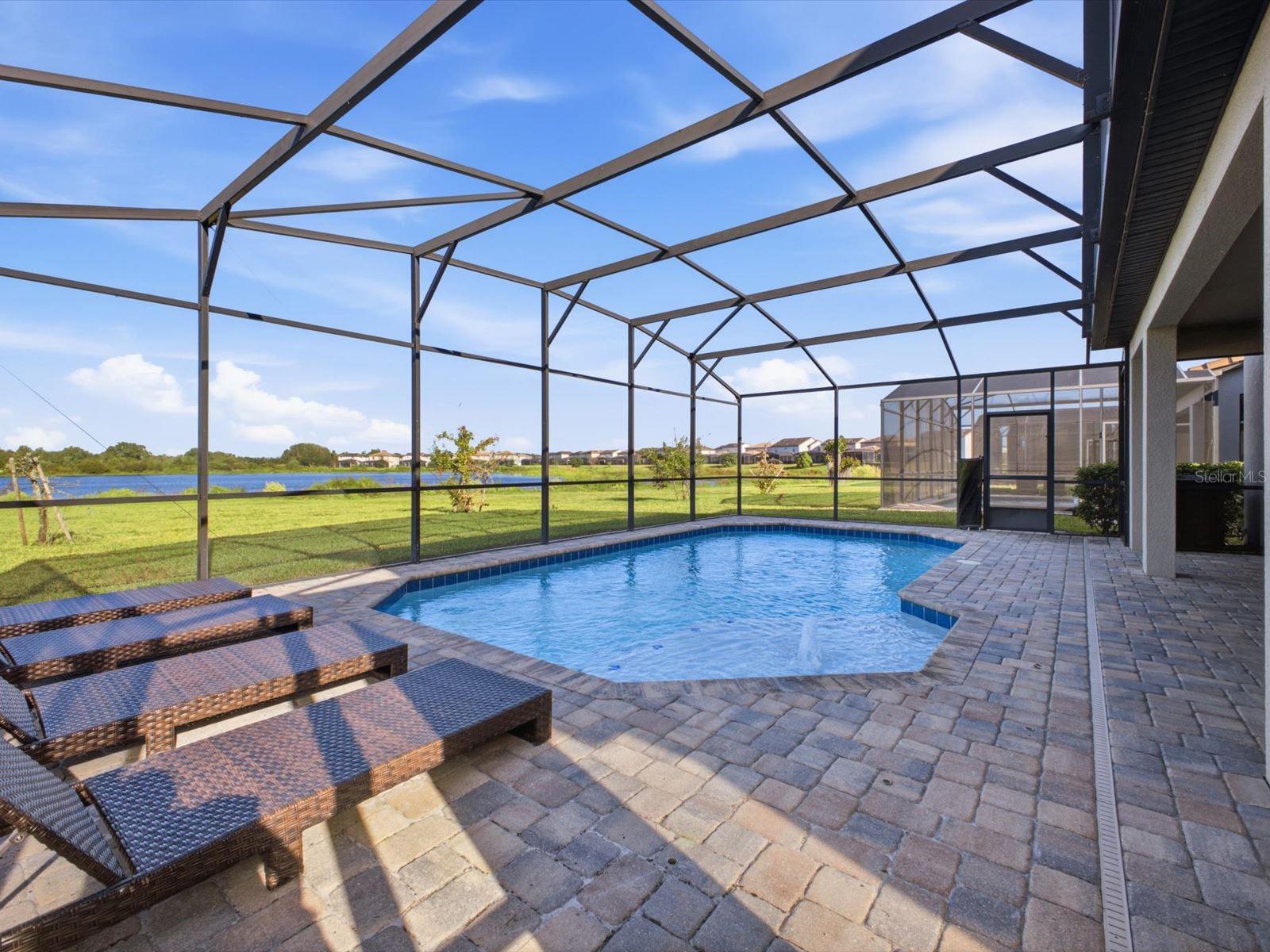 Screened in west facing pool with water view