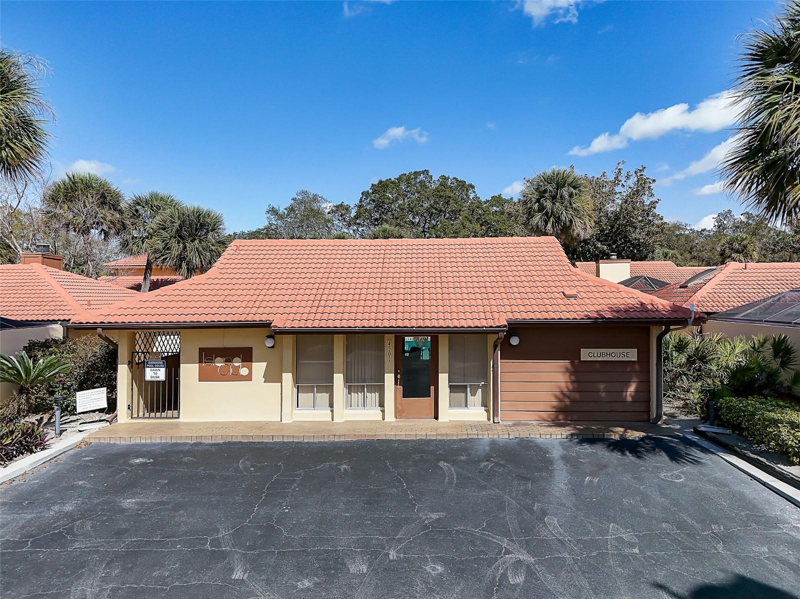 The Island Club HOA covers professionally maintained landscaping and grounds, roof maintenance, exterior painting, and access to the community clubhouse, fitness center, and Olympic-size community swimming pool. Community-wide exterior painting is planned for 2027.