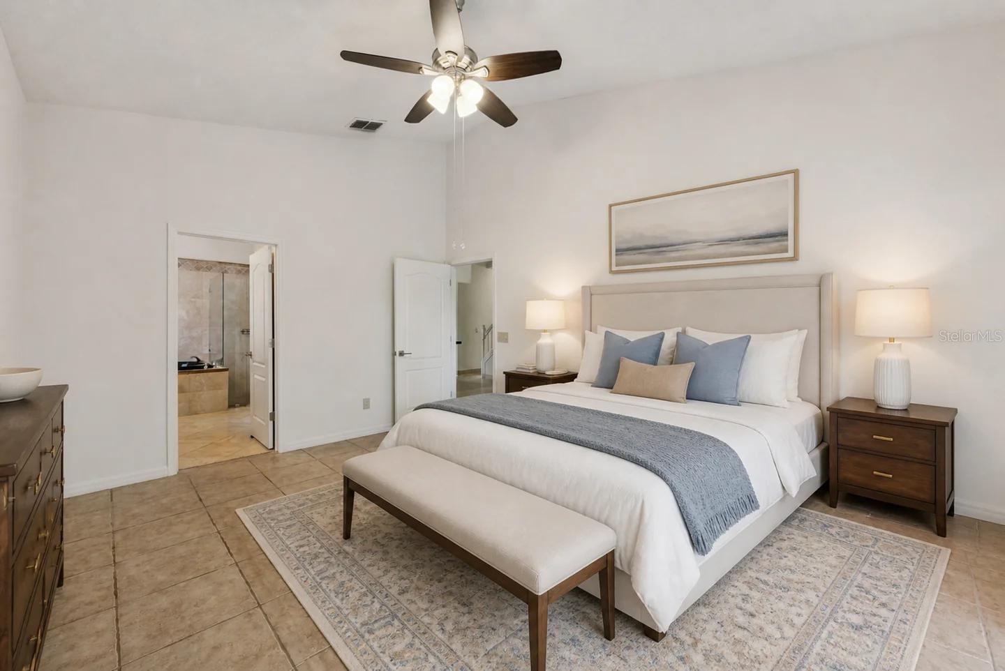Primary bedroom on the 1st floor, with access to the pool.