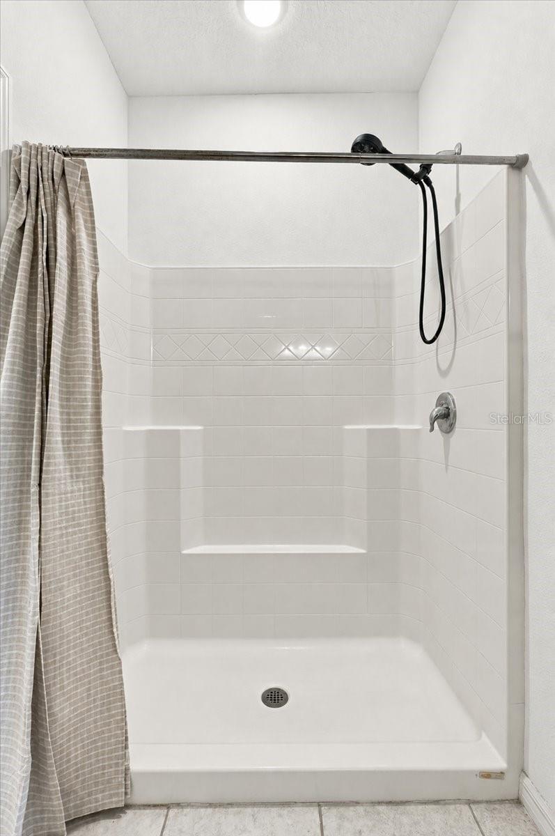 Primary ensuite bathroom featuring a spacious walk-in shower for everyday comfort and convenience. Primary ensuite bathroom featuring a spacious walk-in shower for everyday comfort and convenience.