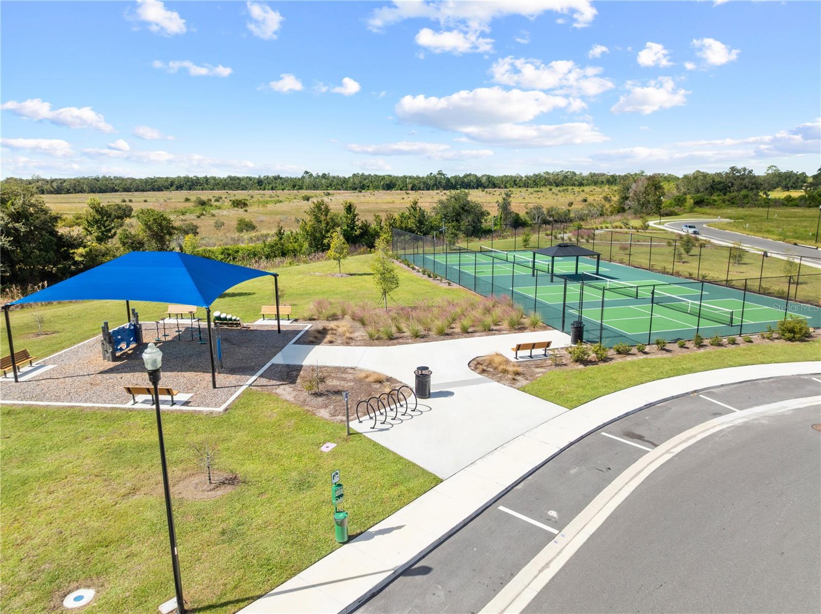 Aerial of community park and tennis court
