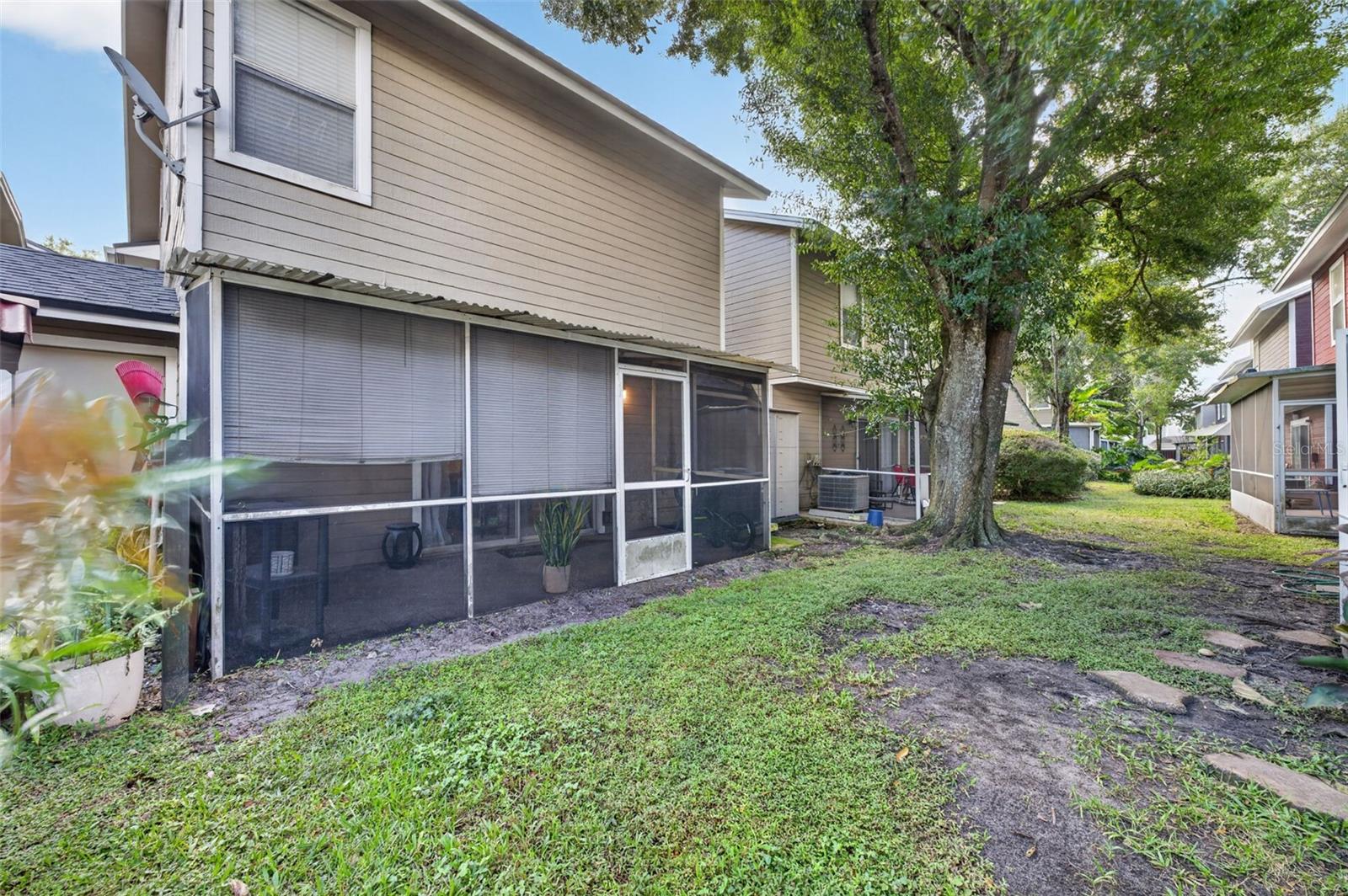 Rear of the home has great porch and green space.
