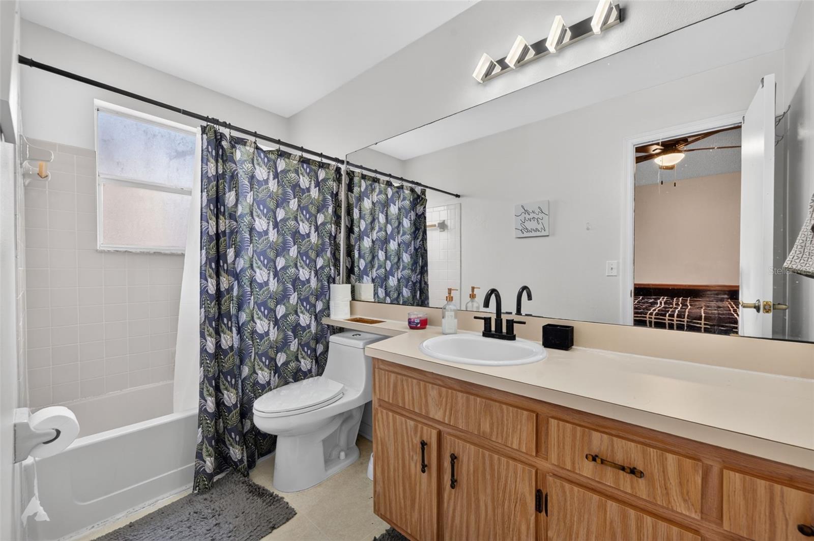 Ensuite bathroom upstairs with large vanity.