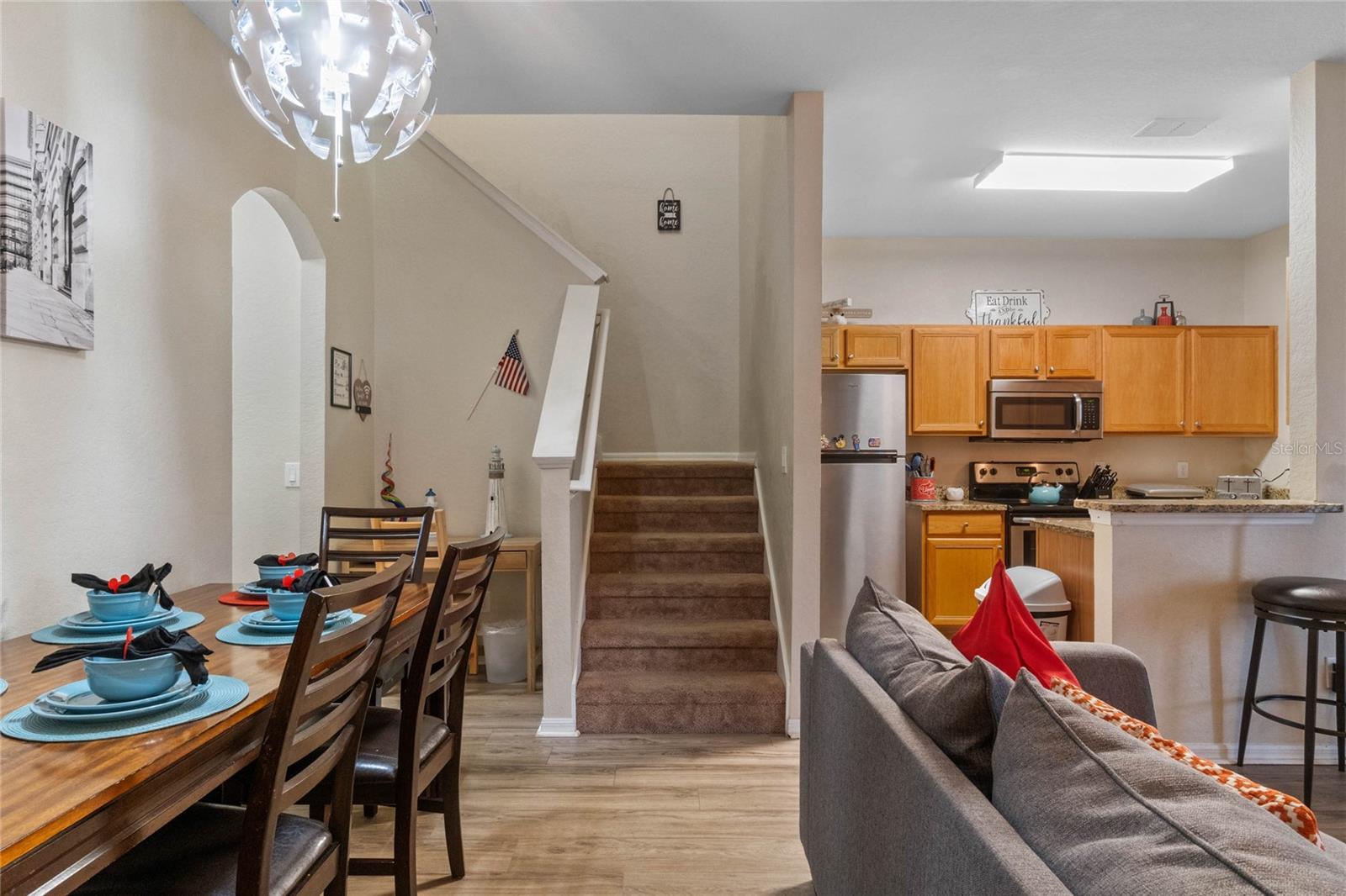 Dining area with view to kitchen and stairs Dining area with view to kitchen and stairs