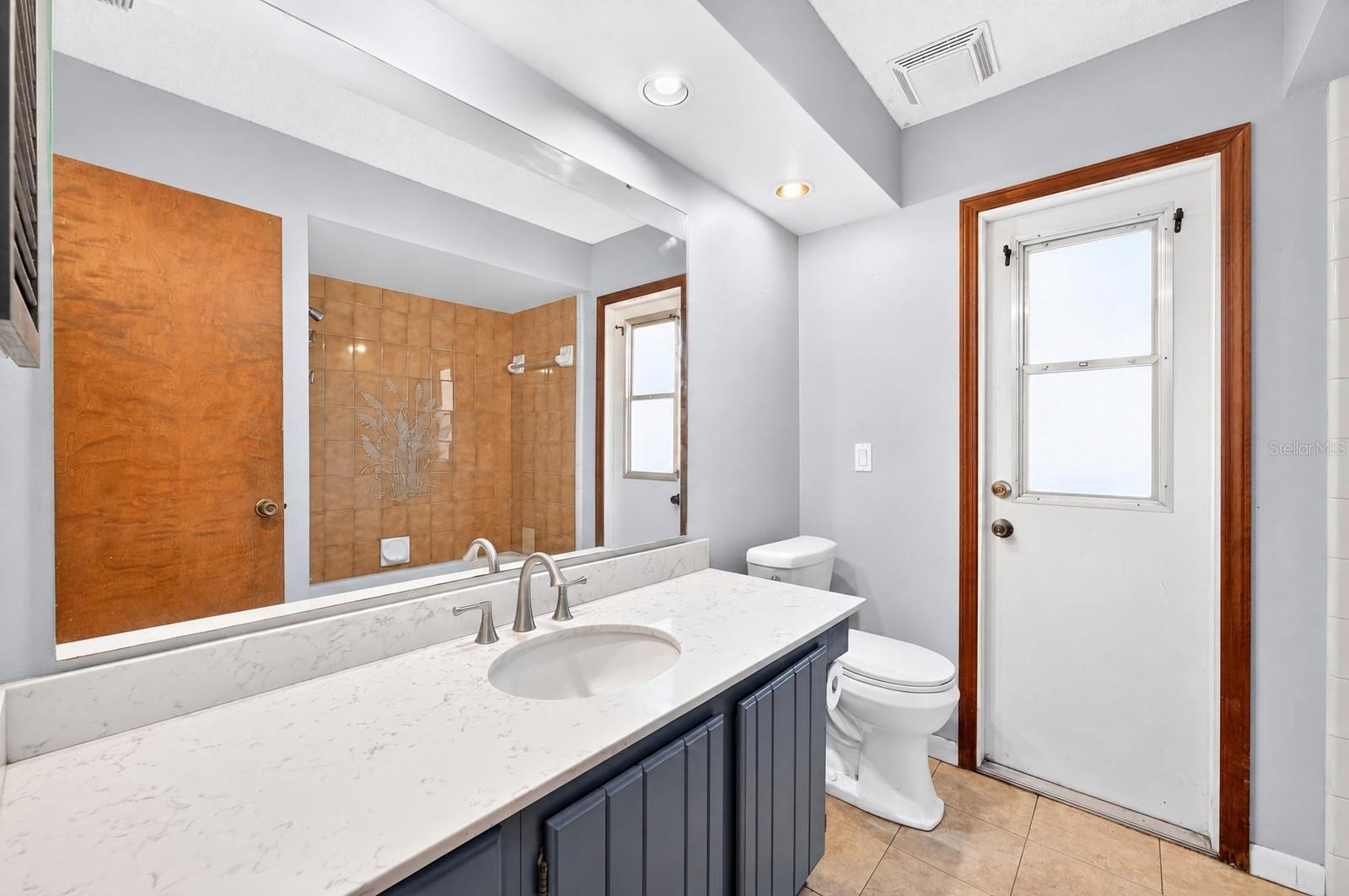 Second full bath has exterior access.