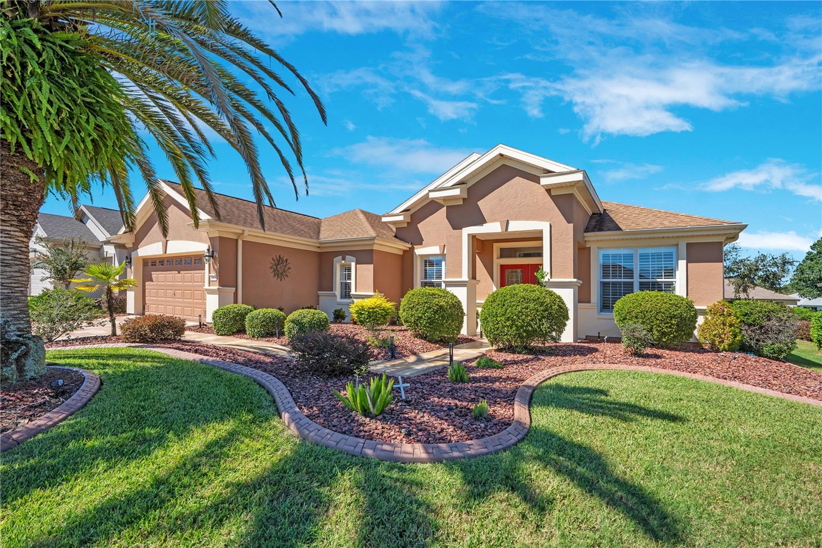 Desirable Granville model in gated Spruce Creek Golf & Country Club, offering single-story living in an active 55+ golf community.
