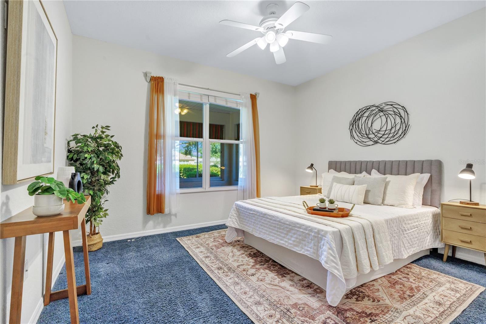 Inviting second bedroom with natural light and a comfortable layout for visiting family and friends.
