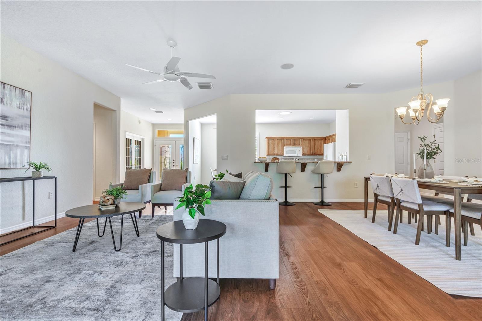 Bright, spacious open floor plan with beautiful flooring and seamless flow between living and dining areas. Bright, spacious open floor plan with beautiful flooring and seamless flow between living and dining areas.