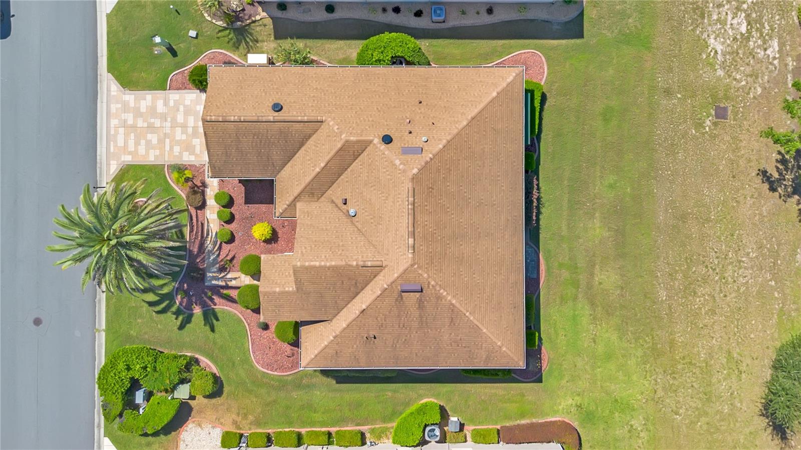 Overhead aerial highlights the Granville model's layout, roofline, and surrounding yard.