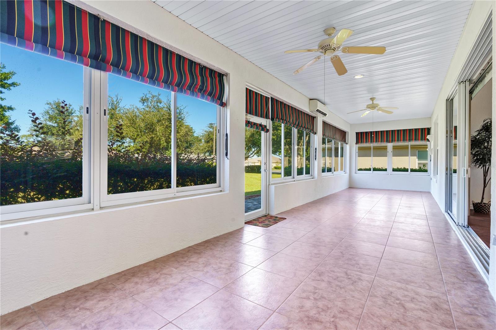 Impressive 40 x 10 enclosed lanai with dedicated split AC, offering approximately 400 square feet of flexible, climate-controlled space.