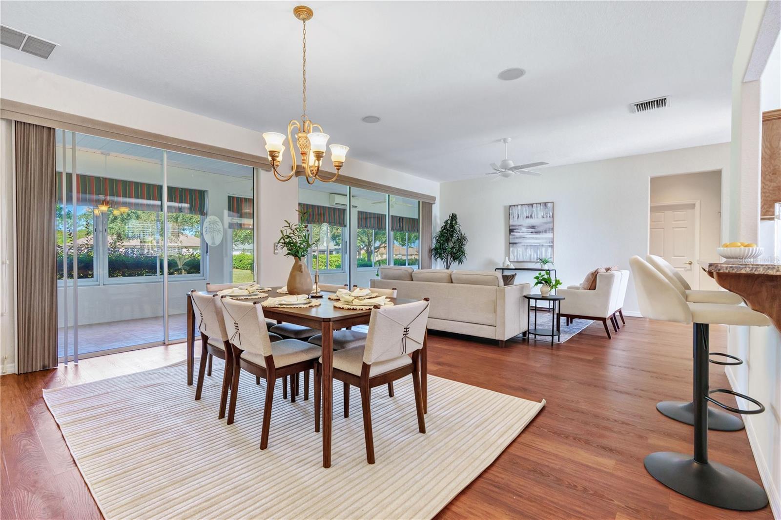 Elegant dining area overlooking the living room, ideal for entertaining and everyday gatherings. Elegant dining area overlooking the living room, ideal for entertaining and everyday gatherings.