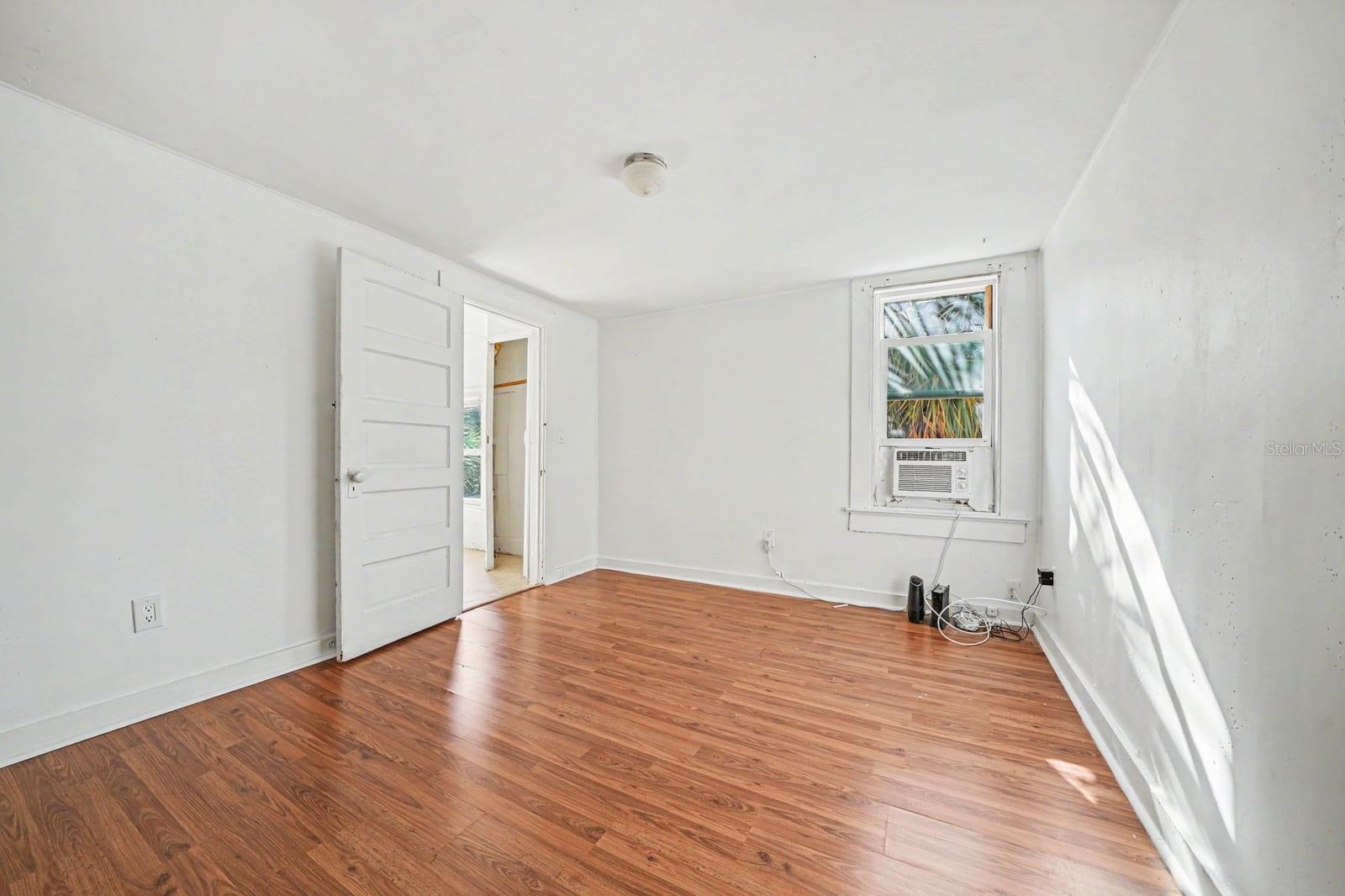 Spacious Bedroom with Hardwood Floors, Large Closet & Bright Window
