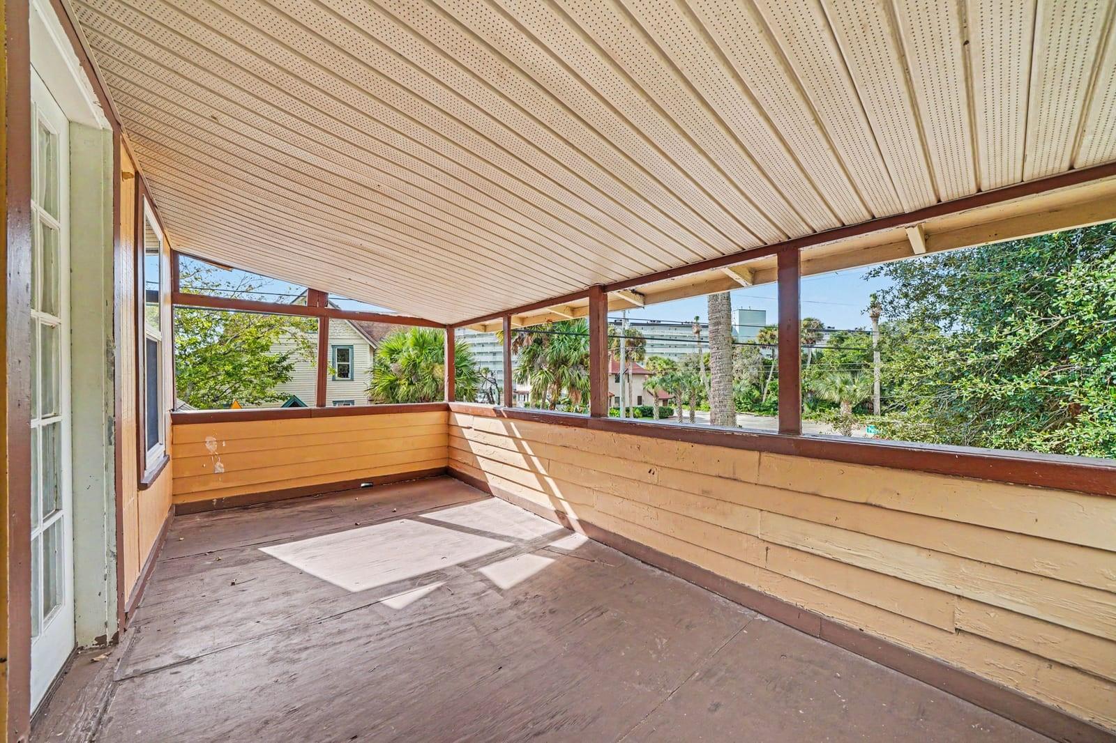 Screened Patio Area with Metal Roof Covering & Garden Views