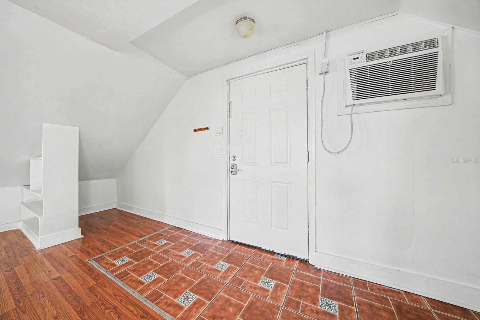 Upper Level Room with A/C Unit, Decorative Tile, Attic Access