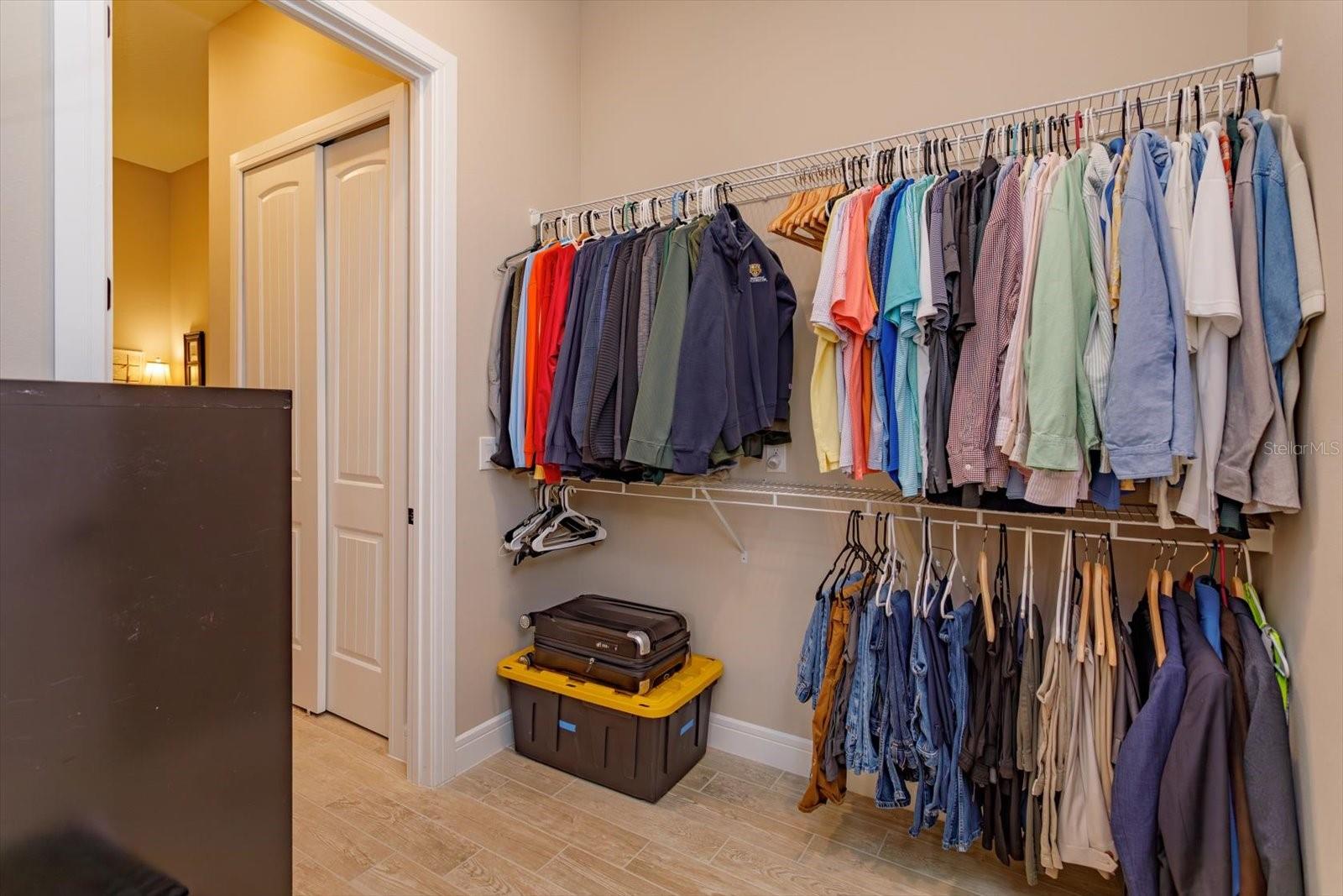Second Walk-in Closet in the primary Suite with a Walk-Through into the Laundry Room