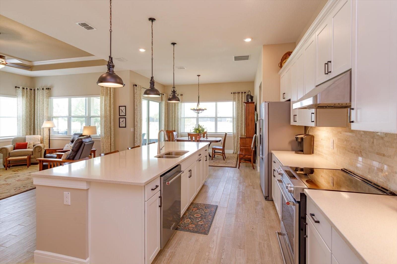 Open Kitchen, Living and Dining Areas with Golf Course Views
