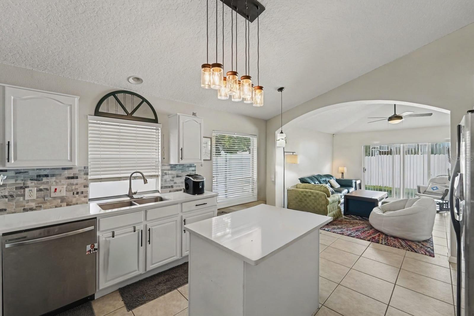 Kitchen island and open floor plan perfect for entertaining and everyday living Kitchen island and open floor plan perfect for entertaining and everyday living