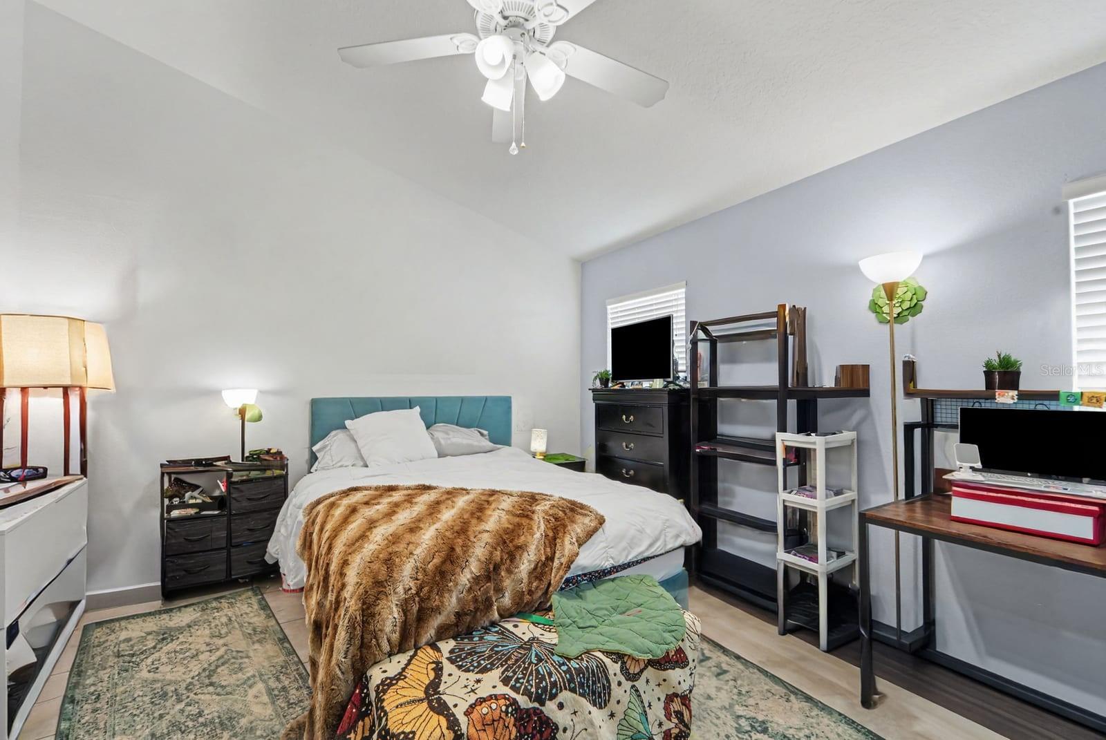 Master Bedroom with Botanical Artwork, Window Light & Comfortable Layout