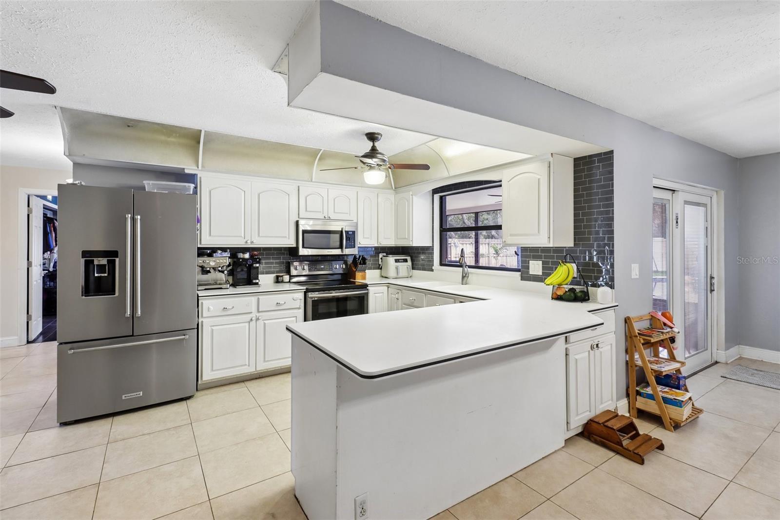 Kitchen is open to the family room and cozy breakfast nook. Kitchen is open to the family room and cozy breakfast nook.
