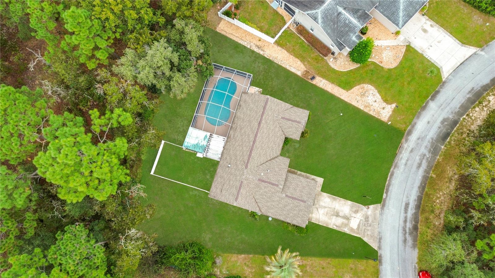 Wooded backdrop and no rear neighbors add privacy.