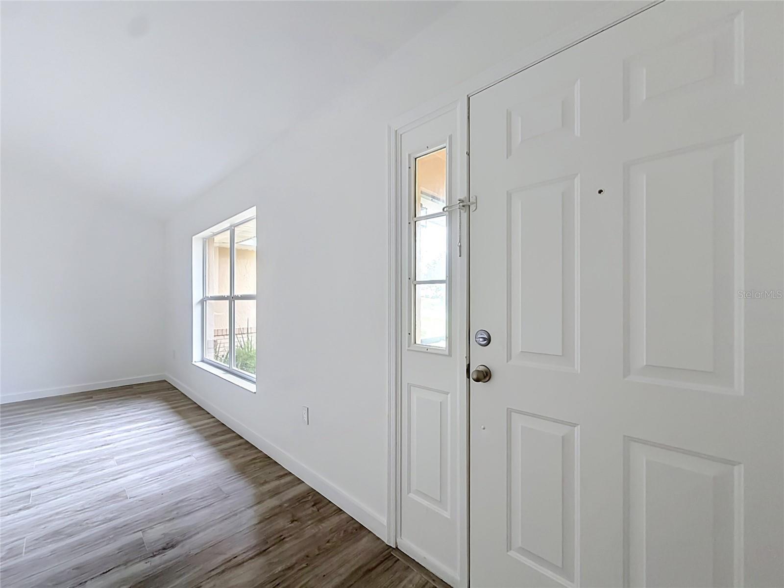 Step inside to natural light and wood-look flooring.
