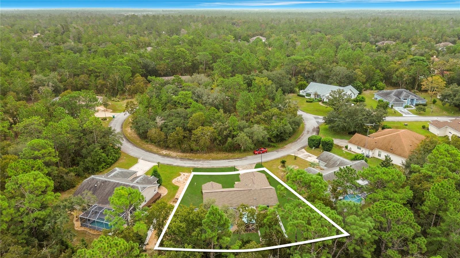A wooded setting. Lot lines shown are approximate.