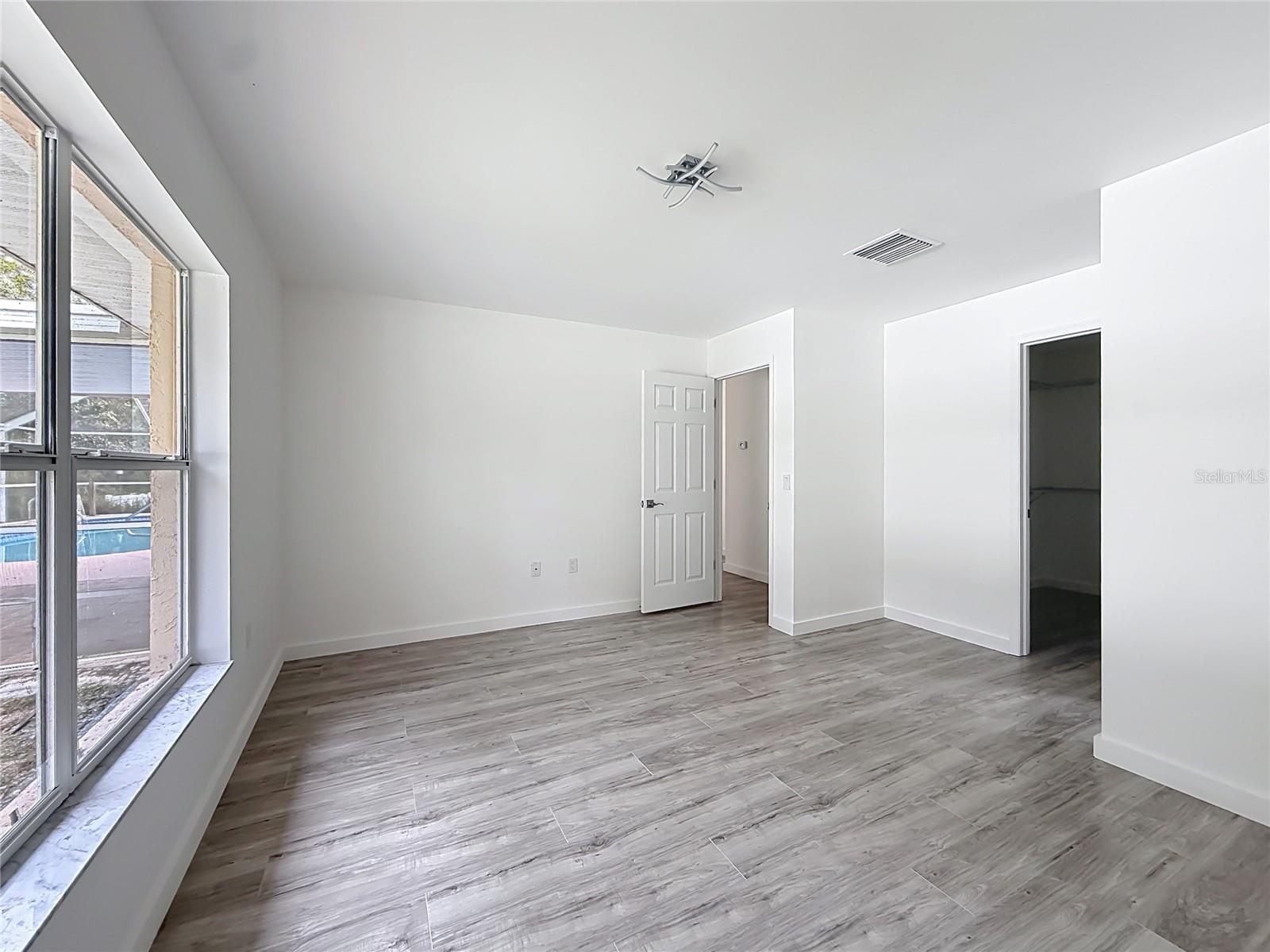 Your primary retreat with a spacious walk-in closet.