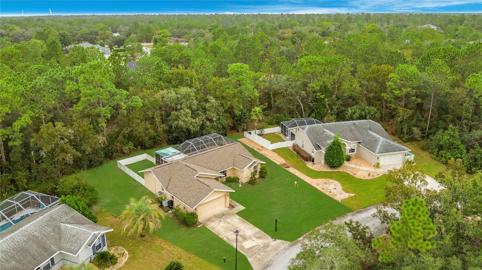 Your pool retreat amid a canopy of mature trees.