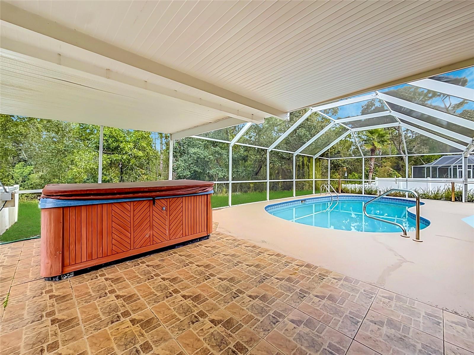 Your shaded retreat beside a private screened pool