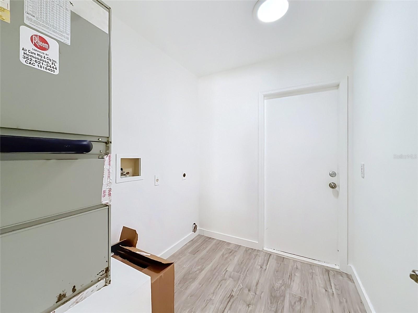 A dedicated laundry area with added storage potential.