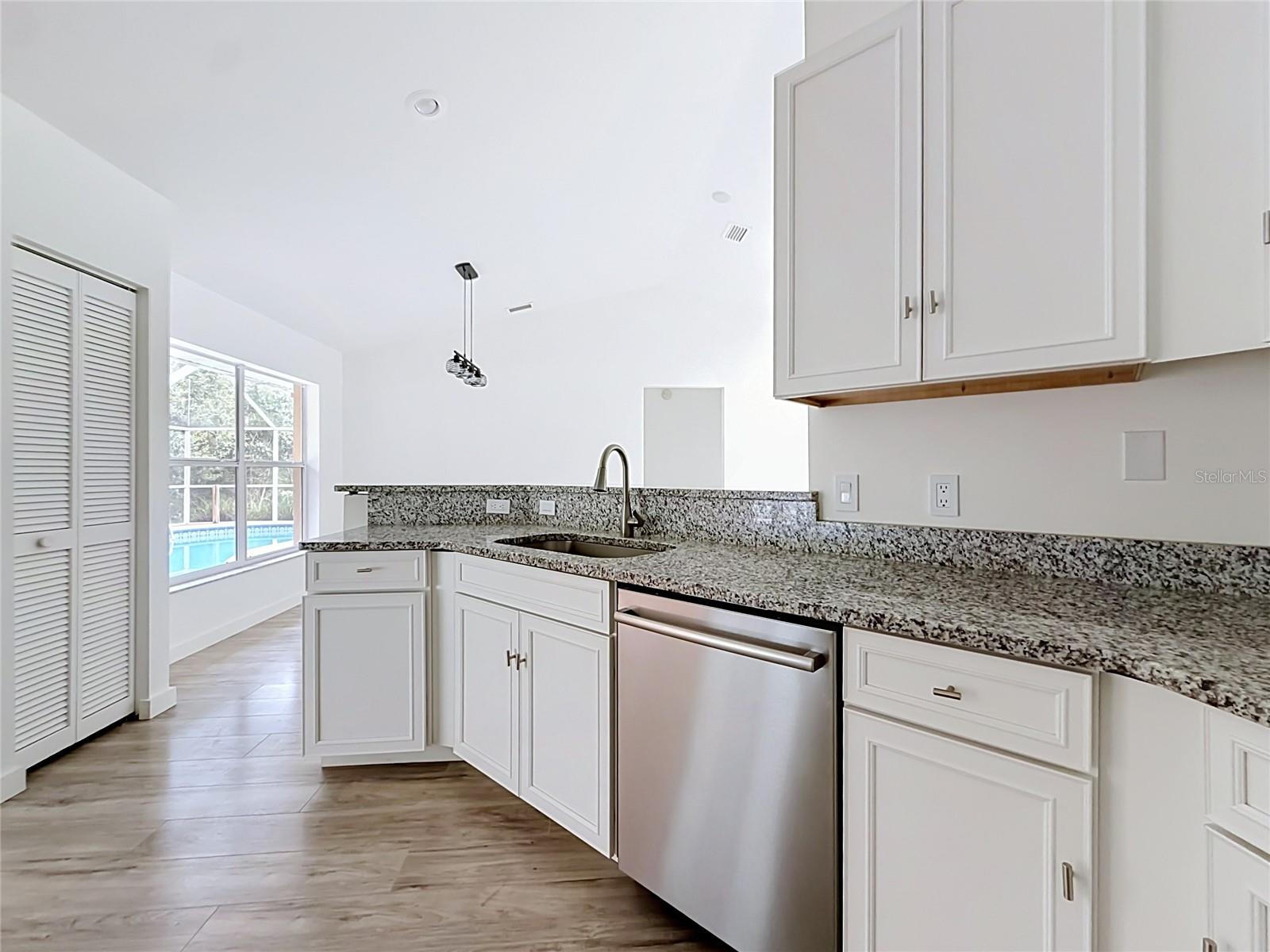 White cabinetry and generous prep space for daily meals.