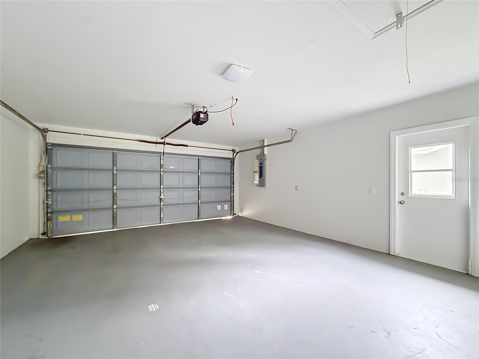 Two-car garage with room for parking and storage.