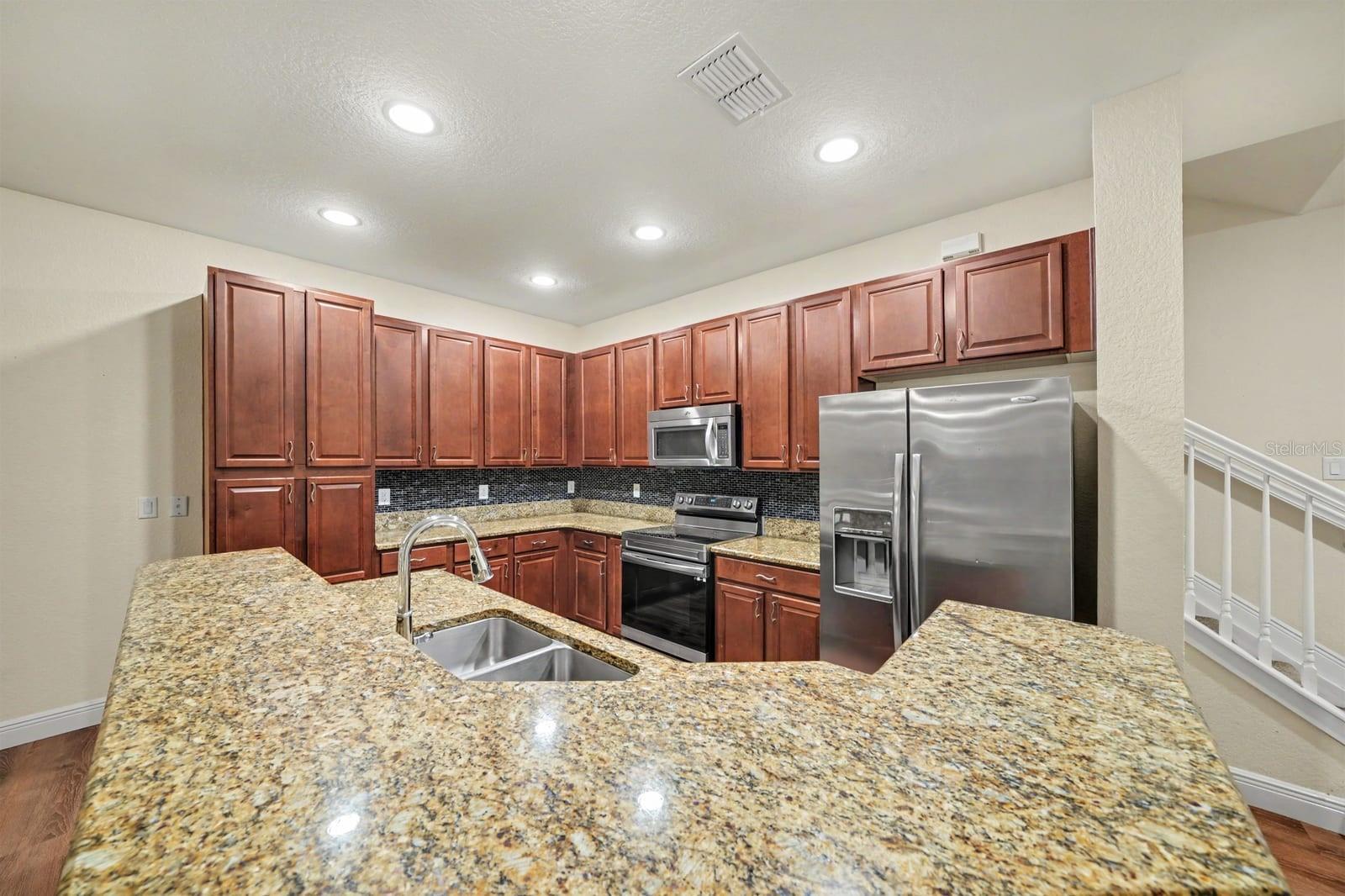 Open Concept Kitchen With Dual Islands & Premium Granite Counters