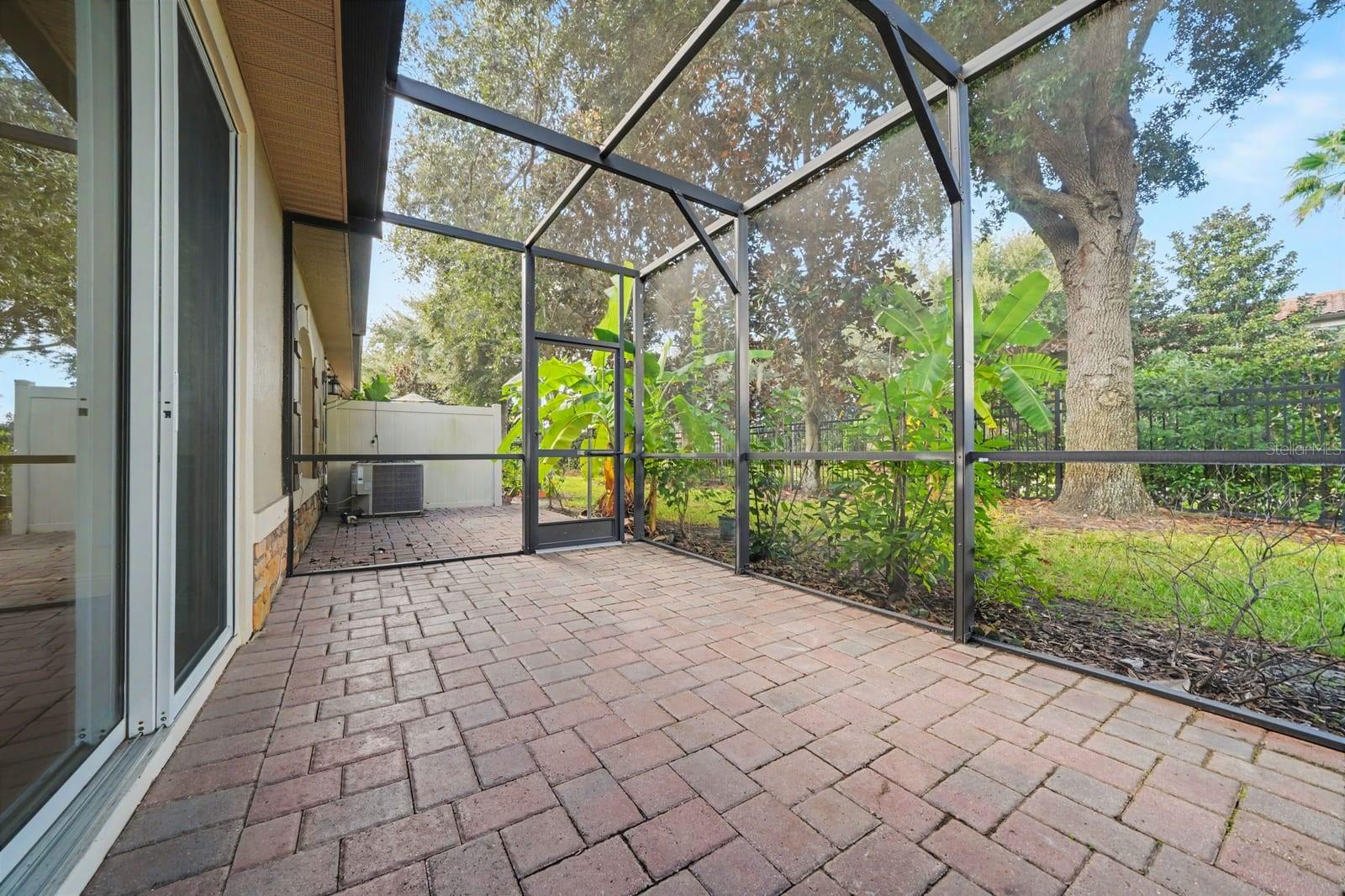Screened Patio Overlooking Mature Trees & Landscaped Grounds