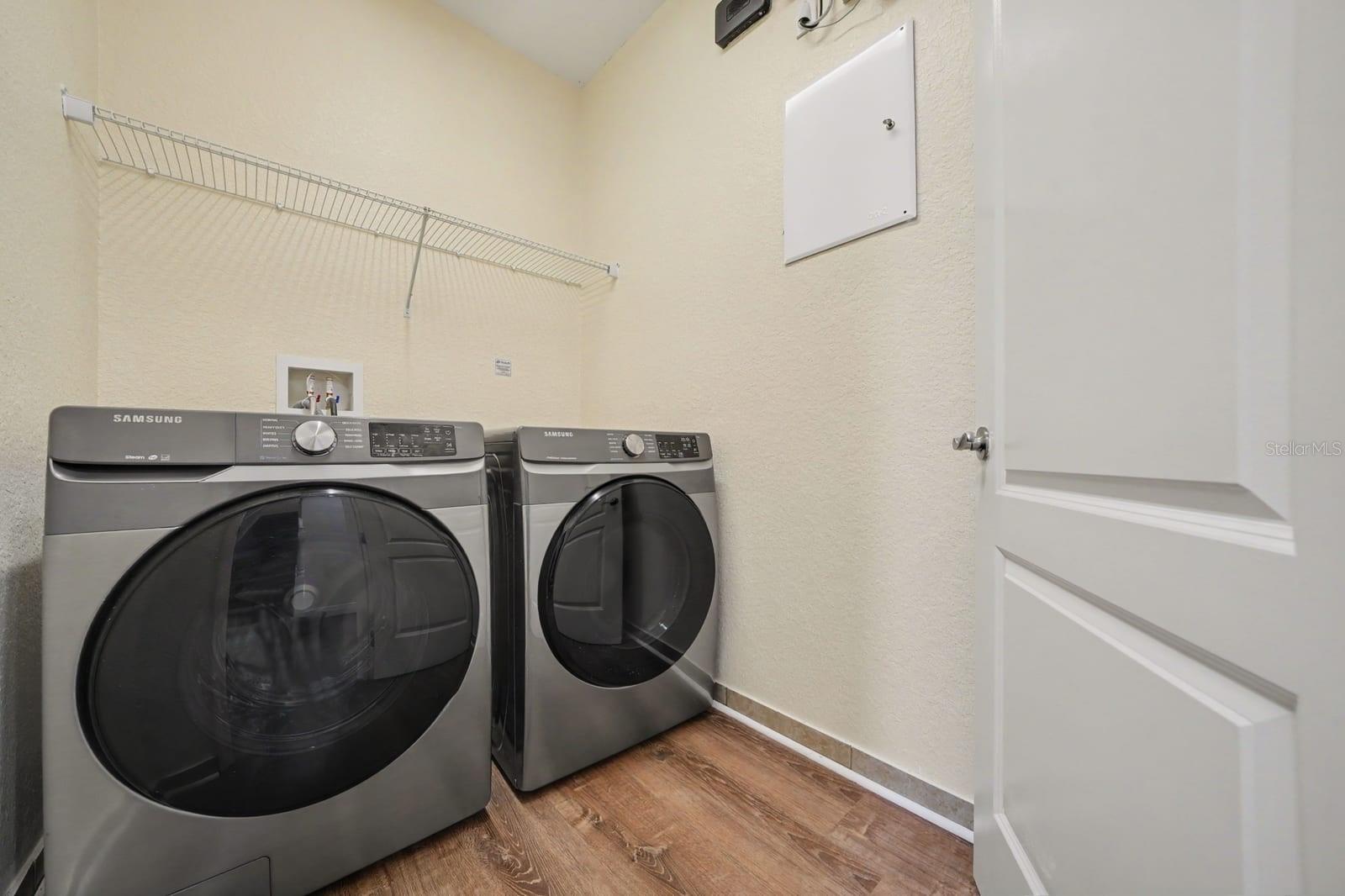 Laundry Room with Samsung Washer & Dryer, Storage Shelf & Windows