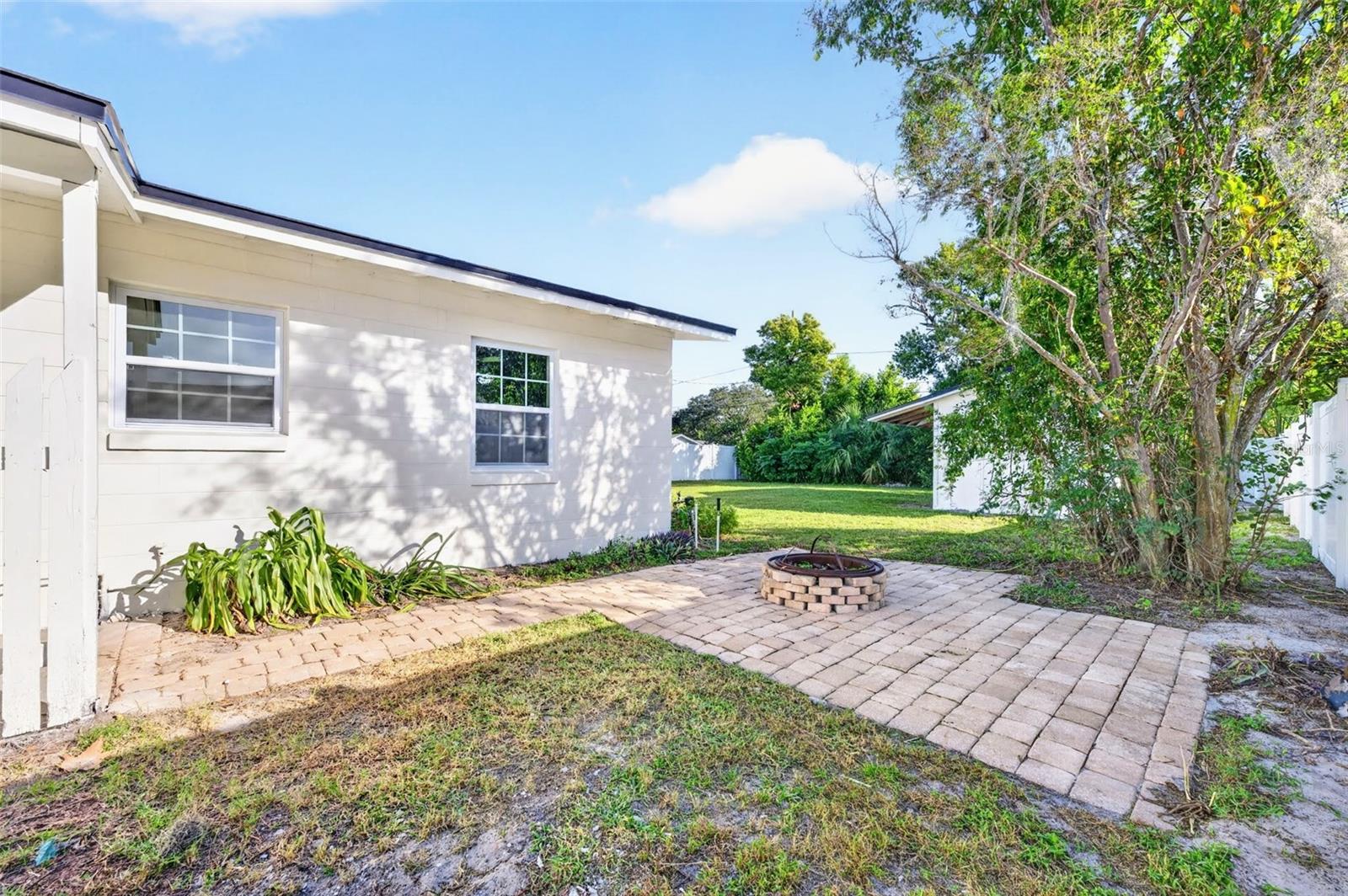 Right off the laundry room is the side lot with a fireplace to cozy up and relax after those stressful days.