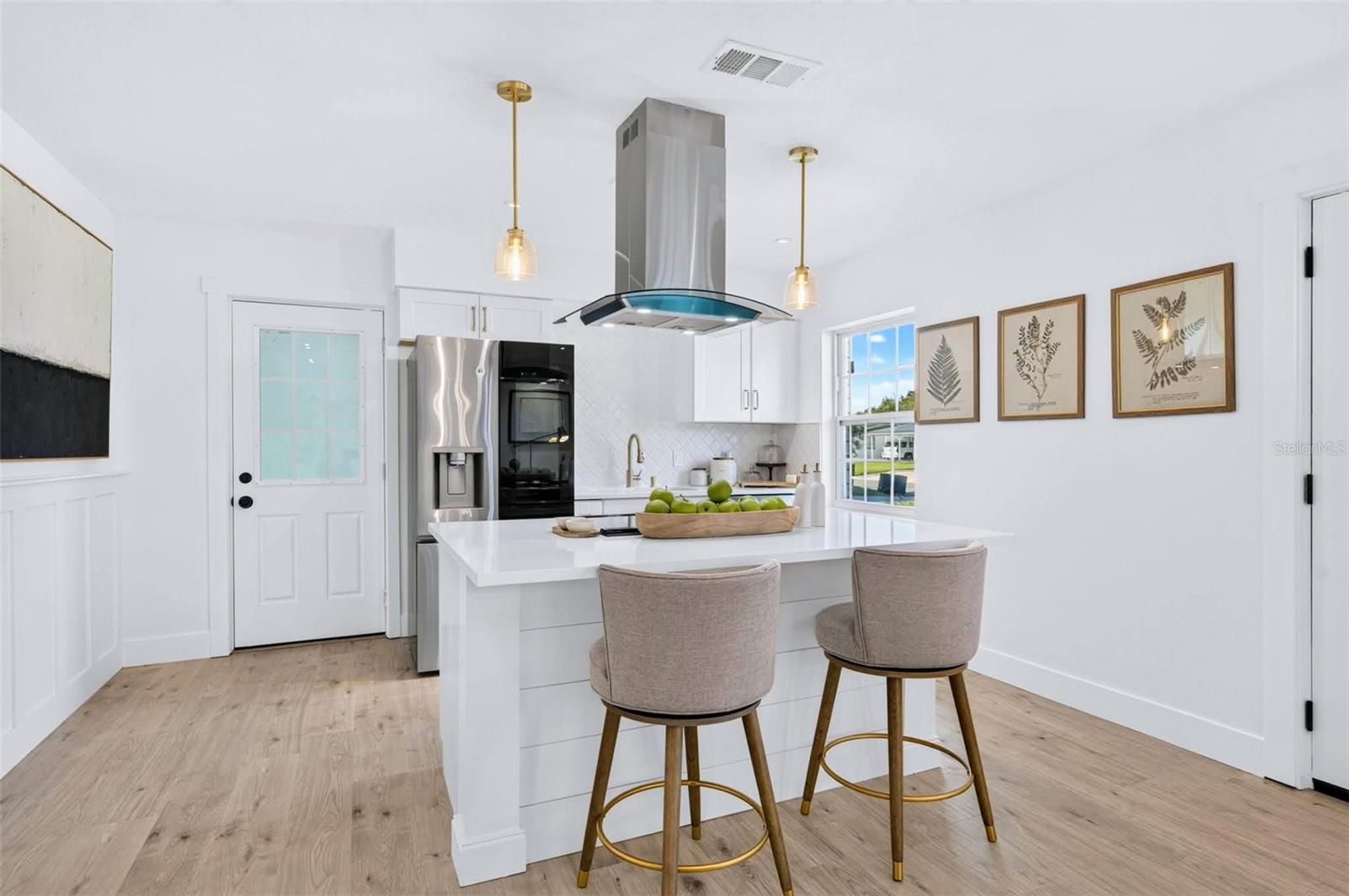 This kitchen island has electric in the island with custom shiplap backing.