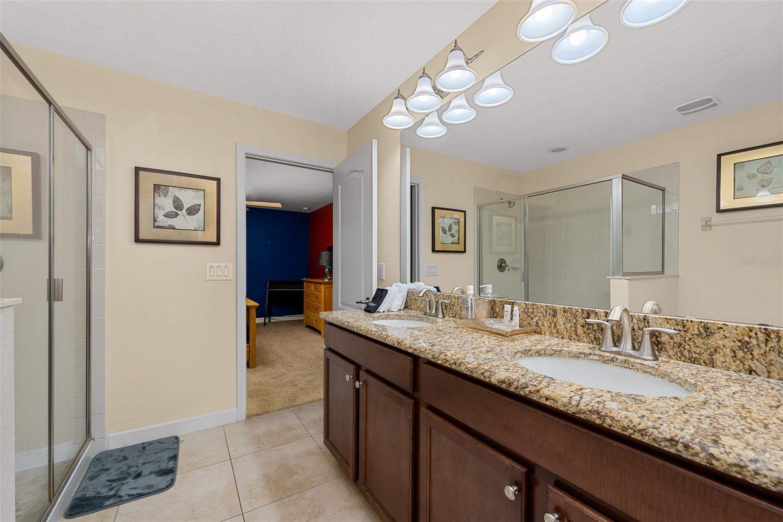 Full Guest Bathroom with Granite Vanity and Glass-Enclosed Shower