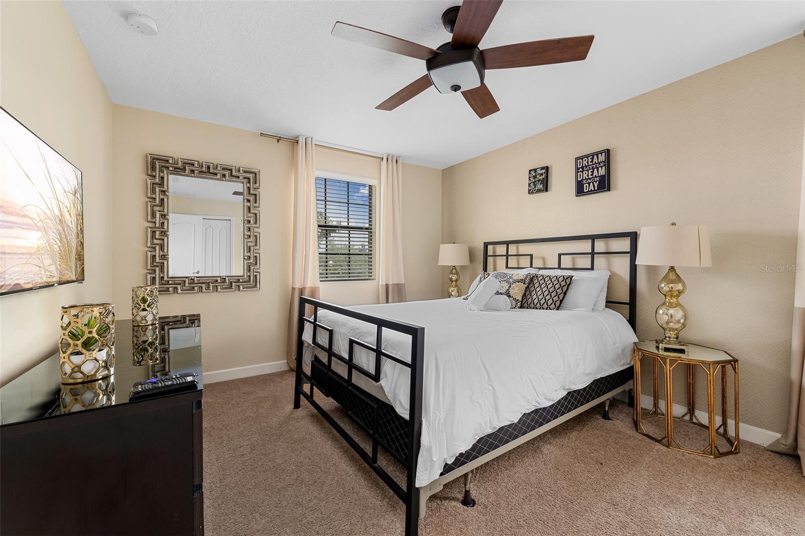 Spacious Second-Floor Primary Suite with King Bed and Ceiling Fan