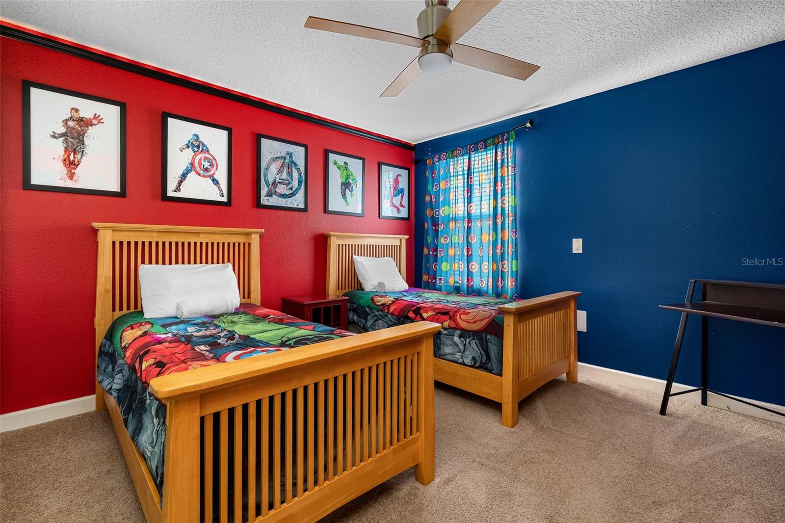 Avengers Assemble! Colorful Superhero-Themed Bedroom with Twin Beds and Bold Red and Blue Accents