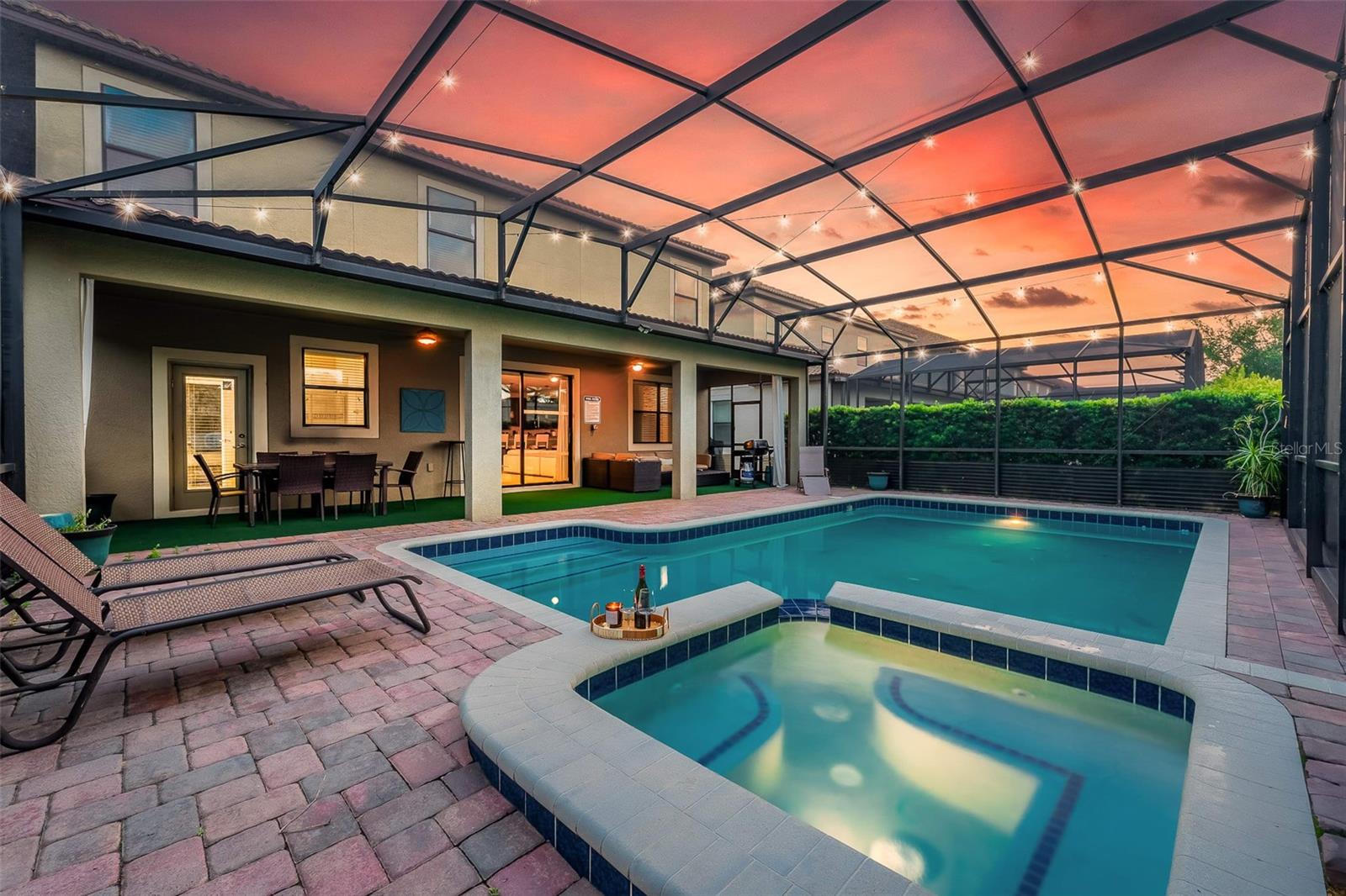 Beautifully Illuminated Pool and Spa, Perfect for Relaxing Florida Evenings