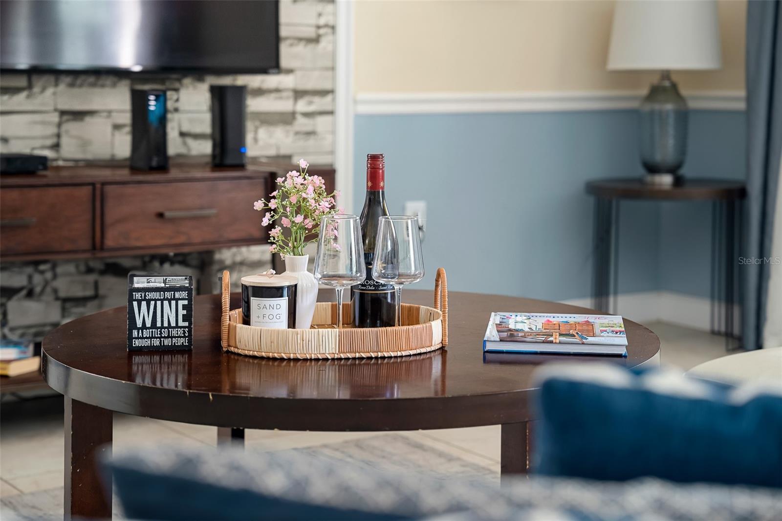 Entertainment-Ready Living Space with Large Television and Comfortable Seating