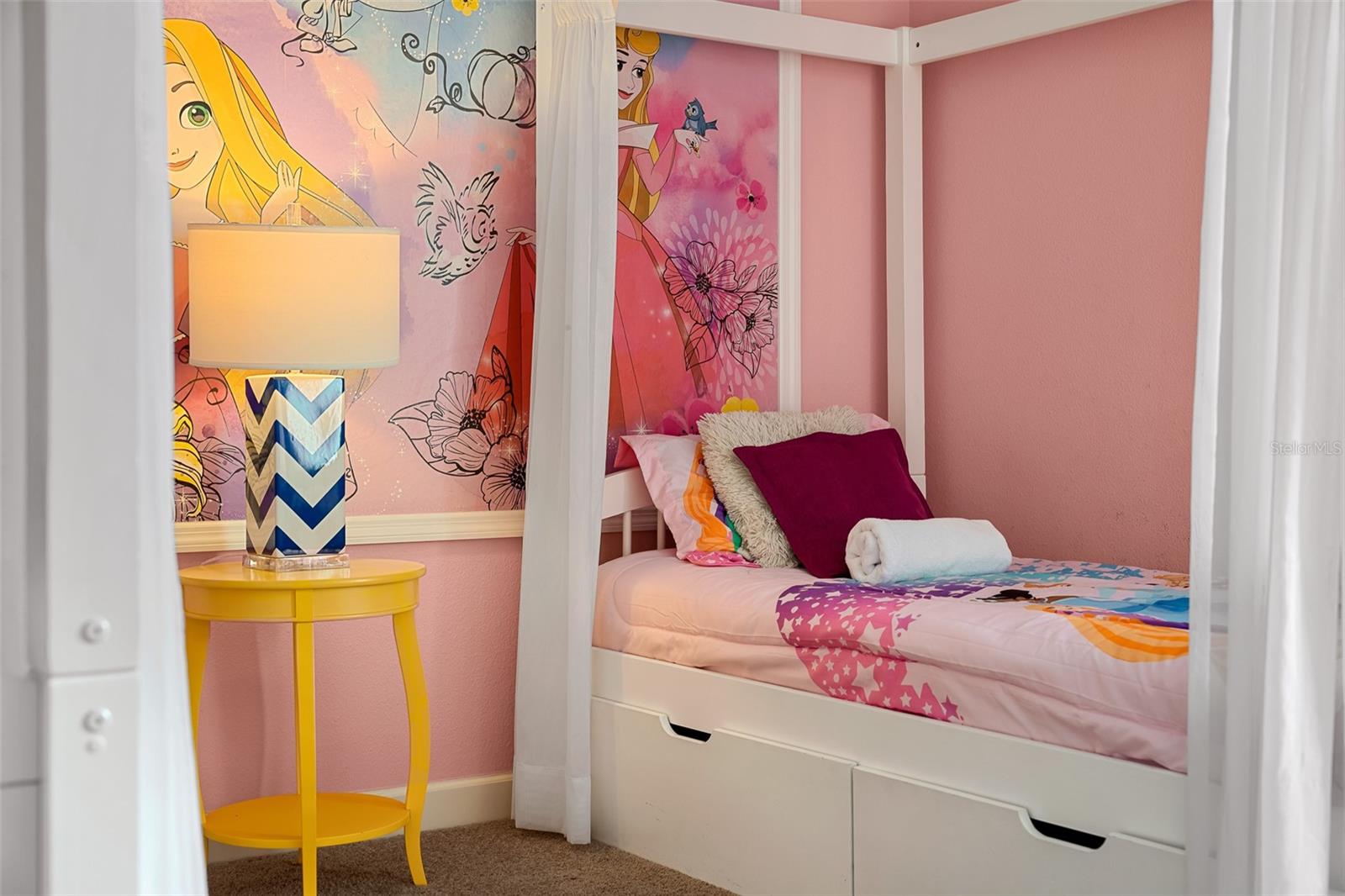 Sweet Princess-Themed Bedroom with Charming Canopy Beds and Playful Pink Details