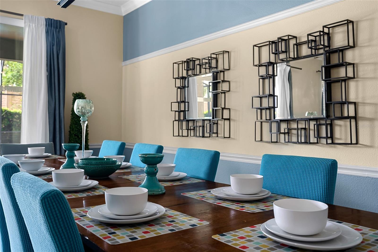 Thoughtful Decorative Details and Stylish Blue Accents Create an Inviting Dining Experience
