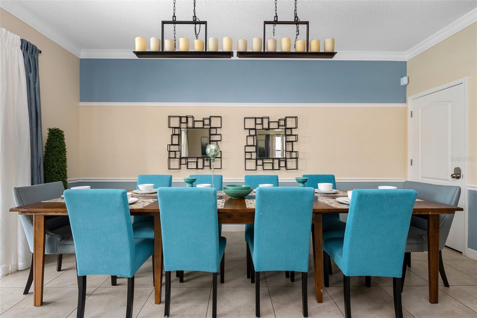 Gather Around the Table! Generous Dining Space with Elegant Statement Lighting and Seating for Large Groups