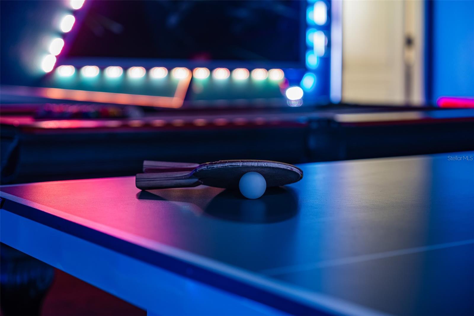 Game Room Detail Featuring Integrated LED Lighting and Gaming Equipment
