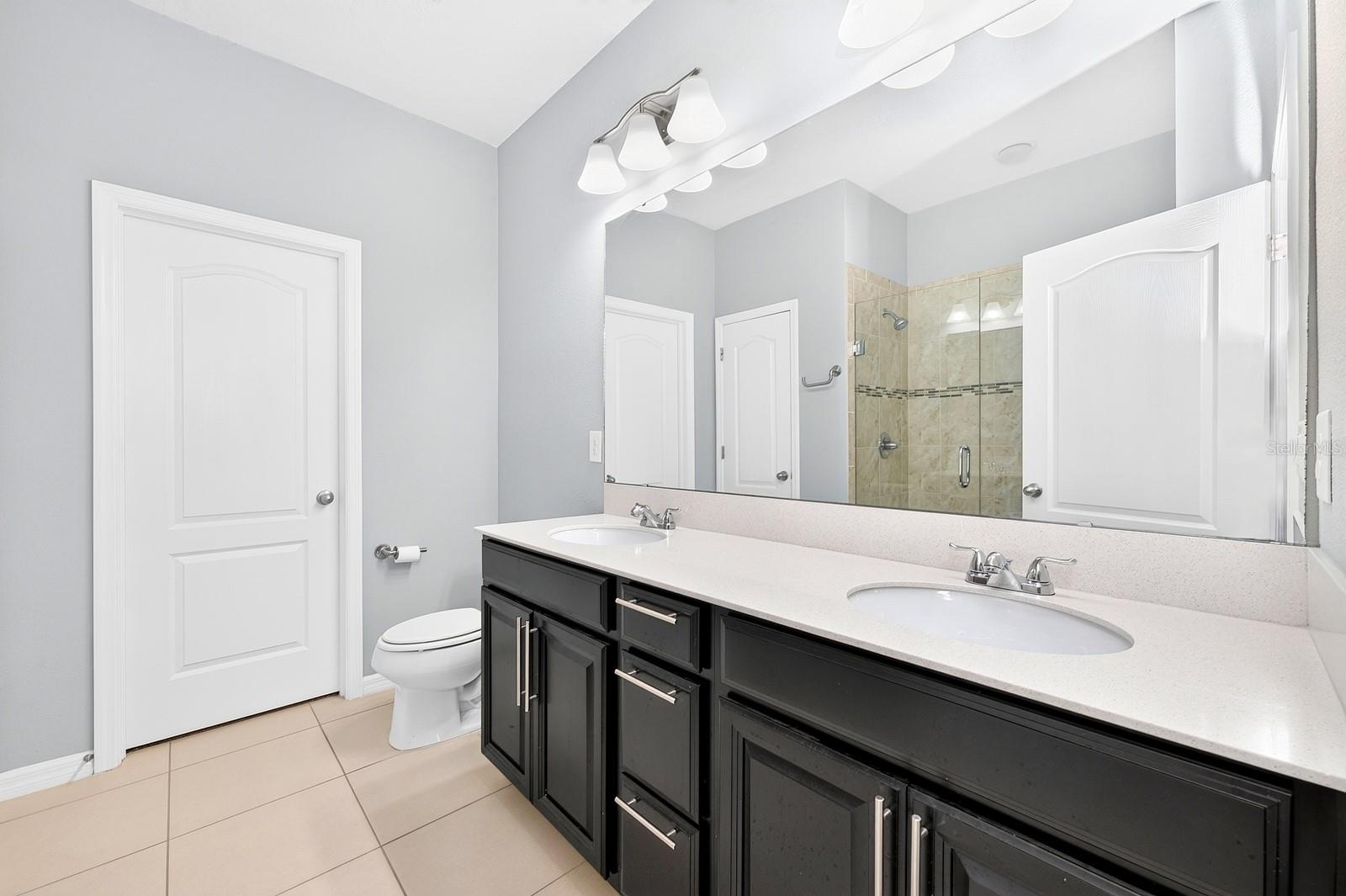 The Primary en suite Bath features a walk-in closet.