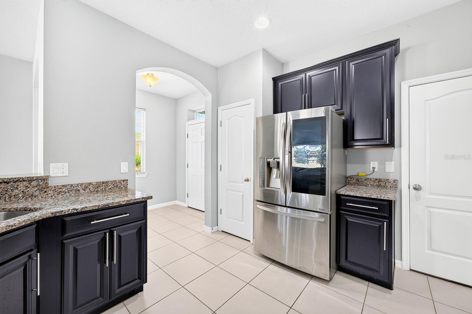 A closet pantry offers convenient storage, while the BREAKFAST BAR provides a natural place for casual meals, conversation or keeping the cook company.