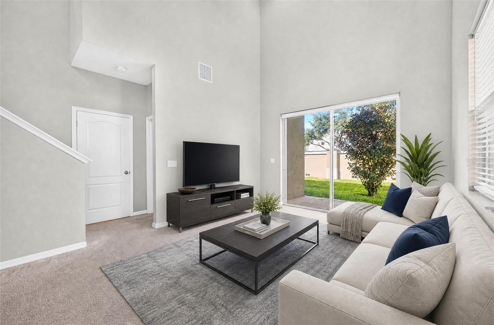 Bright and welcoming, the Living Room provides a comfortable gathering space with an open, airy feel. Virtually Staged